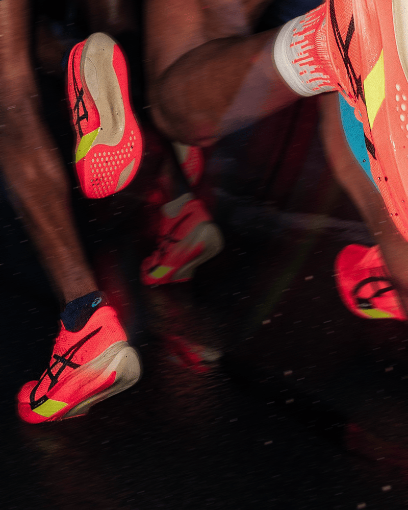 Chaussures de running Asics en course