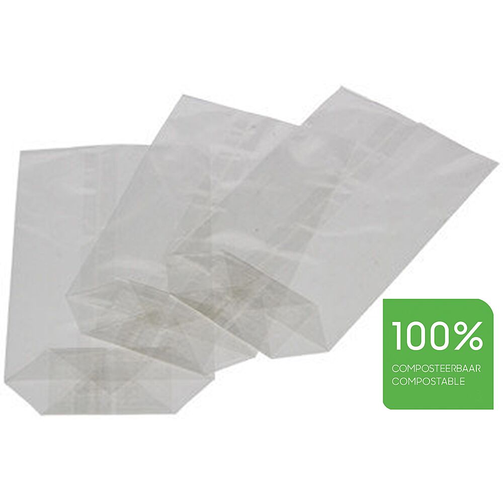 Main Tenant Un Sac En Plastique Transparent Vide Et Une Pile De Sacs En  Papier écologiques Sur La Table